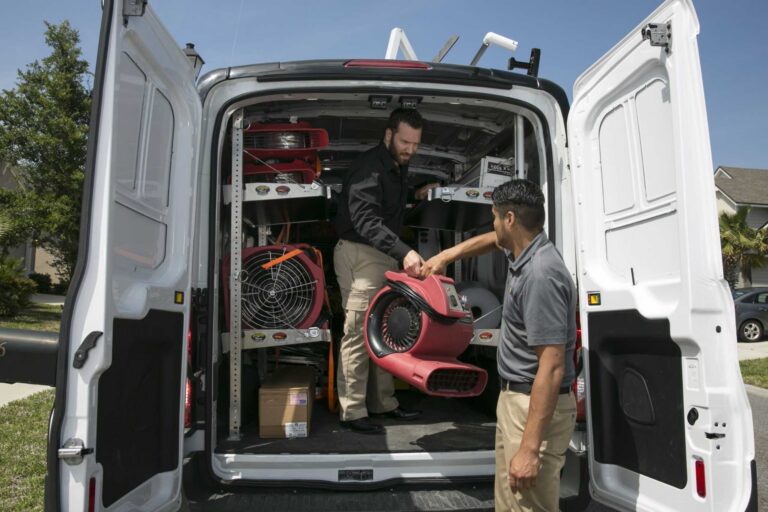 Paul Davis Restoration crew unloading emergency equipment for residential storm damage restoration services in Greater Missoula, MT